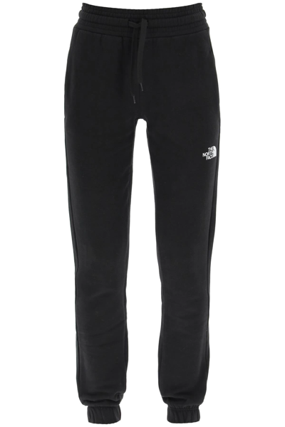 Shop The North Face Logo Print Sweatpants In Black
