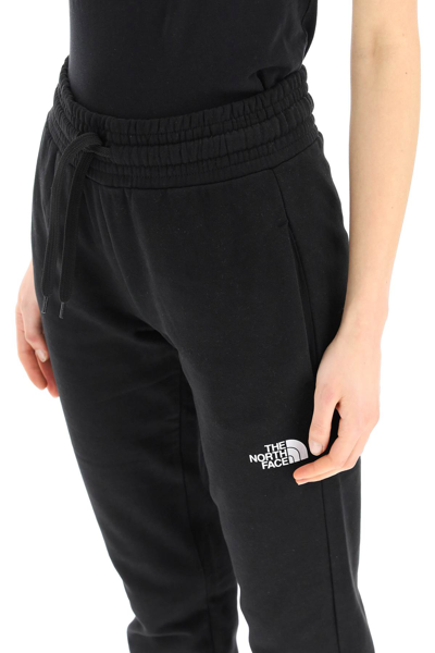 Shop The North Face Logo Print Sweatpants In Black