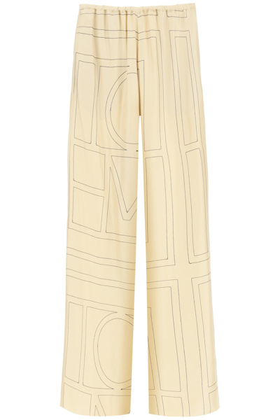 Shop Totême Monogram Embroidered Pajama Trousers In 926