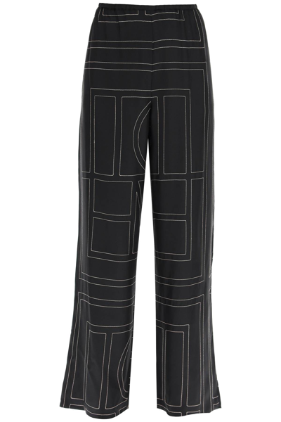Shop Totême Monogram Embroidered Pajama Trousers In 925