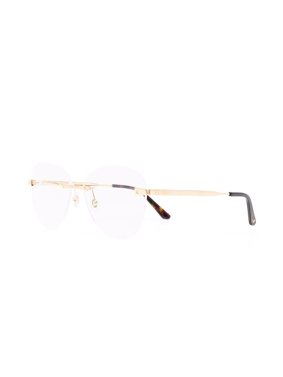 Shop Cartier Round-frame Glasses In Gold