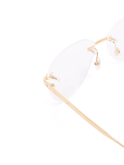 Shop Cartier Round-frame Glasses In Gold