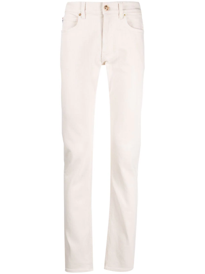 Shop Versace Skinny-cut Mid-rise Jeans In Nude