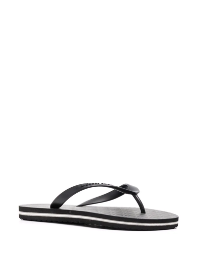 Shop Michael Kors Travis Thong-strap Flip Flops In Schwarz