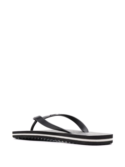 Shop Michael Kors Travis Thong-strap Flip Flops In Schwarz