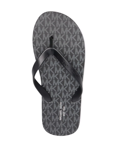 Shop Michael Kors Travis Thong-strap Flip Flops In Schwarz