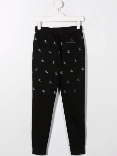 Shop Calvin Klein All-over Logo-print Track Pants In Black