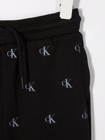Shop Calvin Klein All-over Logo-print Track Pants In Black