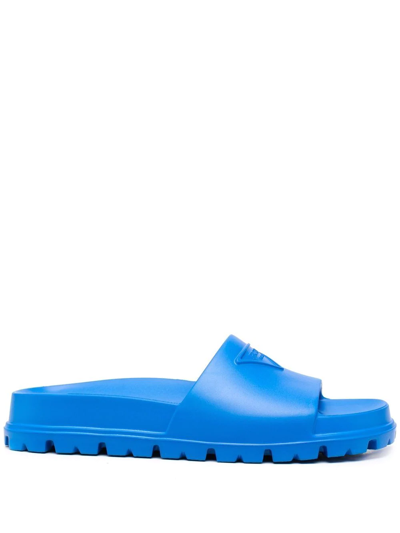 Shop Prada Embossed-logo Ridged-sole Slides In Blau