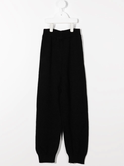 Shop The Row Knitted Cashmere Trousers In Black