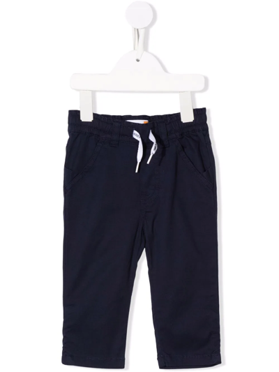 Shop Timberland Drawstring Chino Trousers In Blue