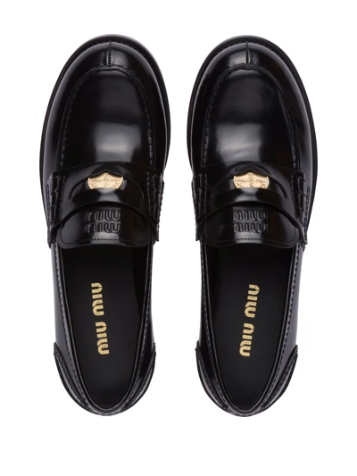 Shop Miu Miu Leather Penny Loafers In Black