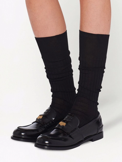 Shop Miu Miu Leather Penny Loafers In Black