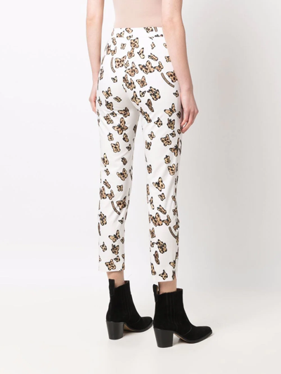 Shop Love Moschino Butterfly-print Cotton Skinny Trousers In Weiss