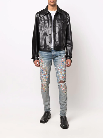 Shop Amiri Paint-splattered Skinny Jeans In Blau