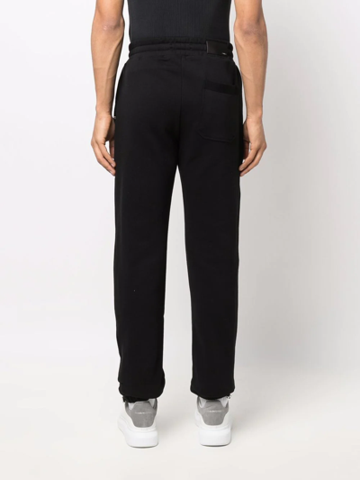 Amiri Logo-print Track Pants In Black