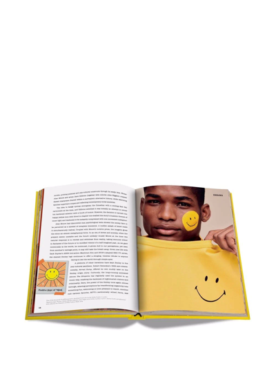 Shop Assouline Smiley: 50 Years Of Good News Book In Yellow