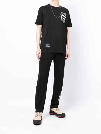 White Mountaineering Logo-print Cotton Sweatpants In Schwarz