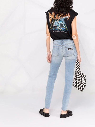Shop Love Moschino Distressed-effect Skinny Jeans In Blau