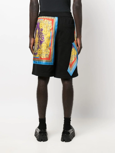 Shop Versace Printed Track Shorts In Schwarz