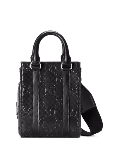 Shop Gucci Gg-embossed Mini Leather Tote Bag In Black