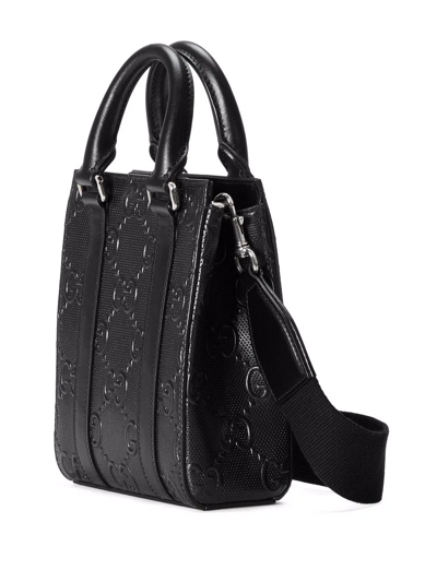 Shop Gucci Gg-embossed Mini Leather Tote Bag In Black