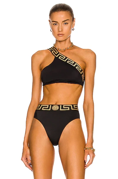 Shop Versace Greca One Shoulder Bikini Top In Nero