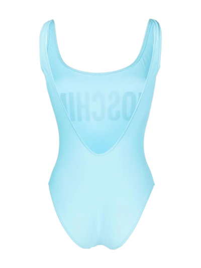 Shop Moschino Logo-print Backless Swimsuit In Blue