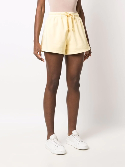 Shop Levi's Embroidered-logo Mini Shorts In Yellow