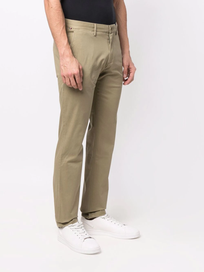 Shop Tommy Hilfiger Slim-cut Chino Trousers In Grün