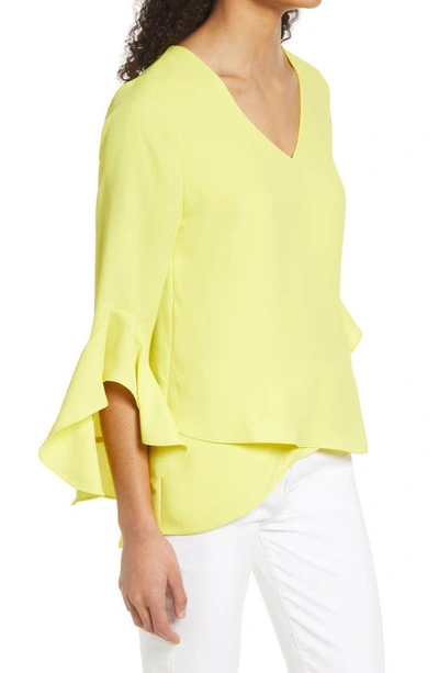 Shop Vince Camuto Flutter Sleeve Tunic In Lemon Yellow