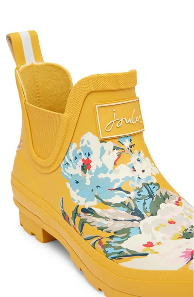 Shop Joules Wellibob Short Rain Boot In Gold Floral