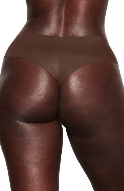 Shop Skims Naked Cheeky Hipster Thong In Cocoa