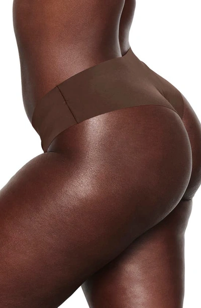 Shop Skims Naked Cheeky Hipster Thong In Cocoa