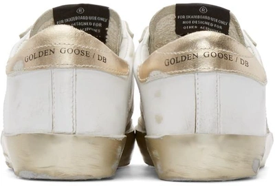 Shop Golden Goose White & Gold Superstar Low-top Sneakers