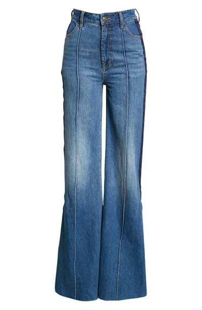 Shop Zimmermann Rhythmic High Waist Super Flare Side Stripe Jeans In High Tide