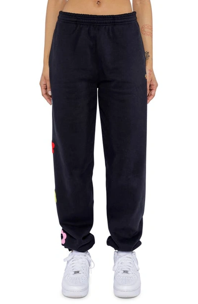 BY SAMII RYAN SMILEY® X BY SAMII RYAN CAUTION SMILES FLOWER SWEATPANTS 