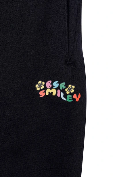 Shop By Samii Ryan Smiley® X  Caution Smiles Flower Sweatpants In Black