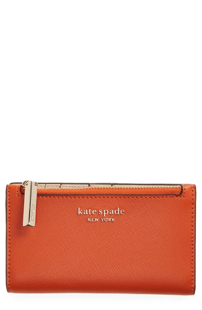 Shop Kate Spade Small Spencer Slim Leather Bifold Wallet In Dried Apricot