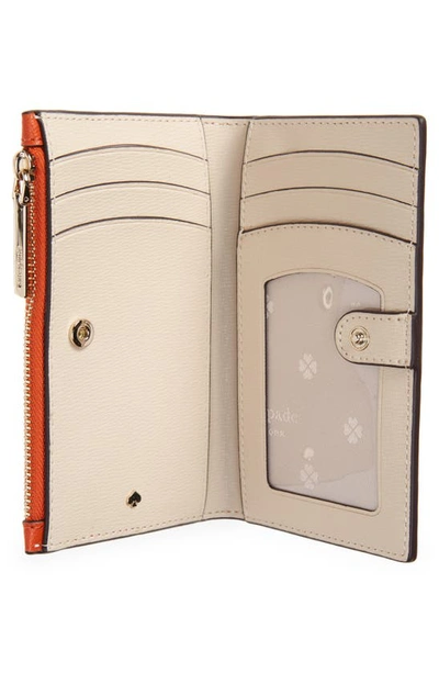 Kate Spade Small Spencer Slim Leather Bifold Wallet In Dried Apricot