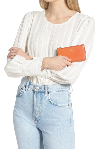 Kate Spade Small Spencer Slim Leather Bifold Wallet In Dried Apricot