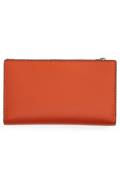 Shop Kate Spade Small Spencer Slim Leather Bifold Wallet In Dried Apricot