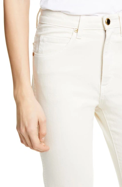 Shop Khaite Vivian Bootcut Jeans In Denim Ivory