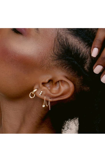 Shop Zoë Chicco Diamond Huggie Hoop Earrings In 14k Yg