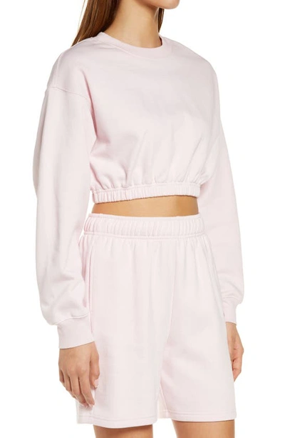 Shop Alo Yoga Devotion Crop Sweatshirt In Pink Sugar