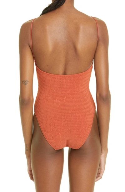 Shop Totême Smocked One-piece Swimsuit In Burnt Orange
