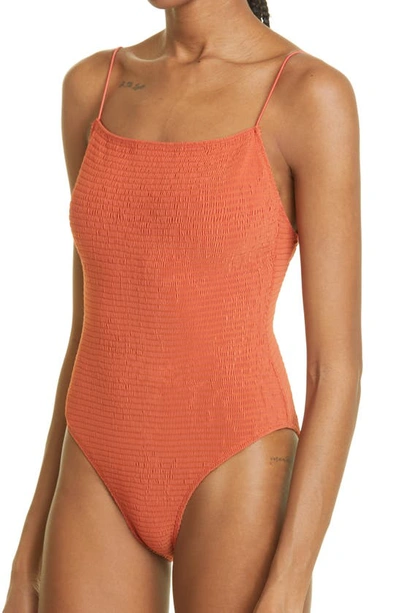 Shop Totême Smocked One-piece Swimsuit In Burnt Orange