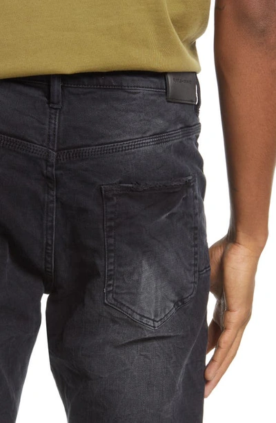 Shop Purple Ripped Knee Blowout Slim Jeans In Black Wash