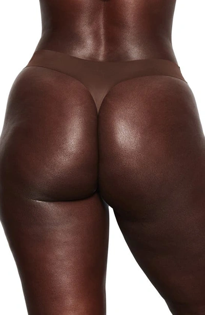 Shop Skims Naked Dipped Thong In Cocoa