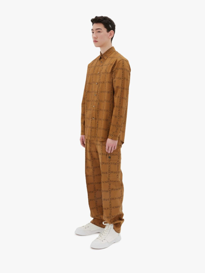 Shop Jw Anderson Cotton Trousers In Brown
